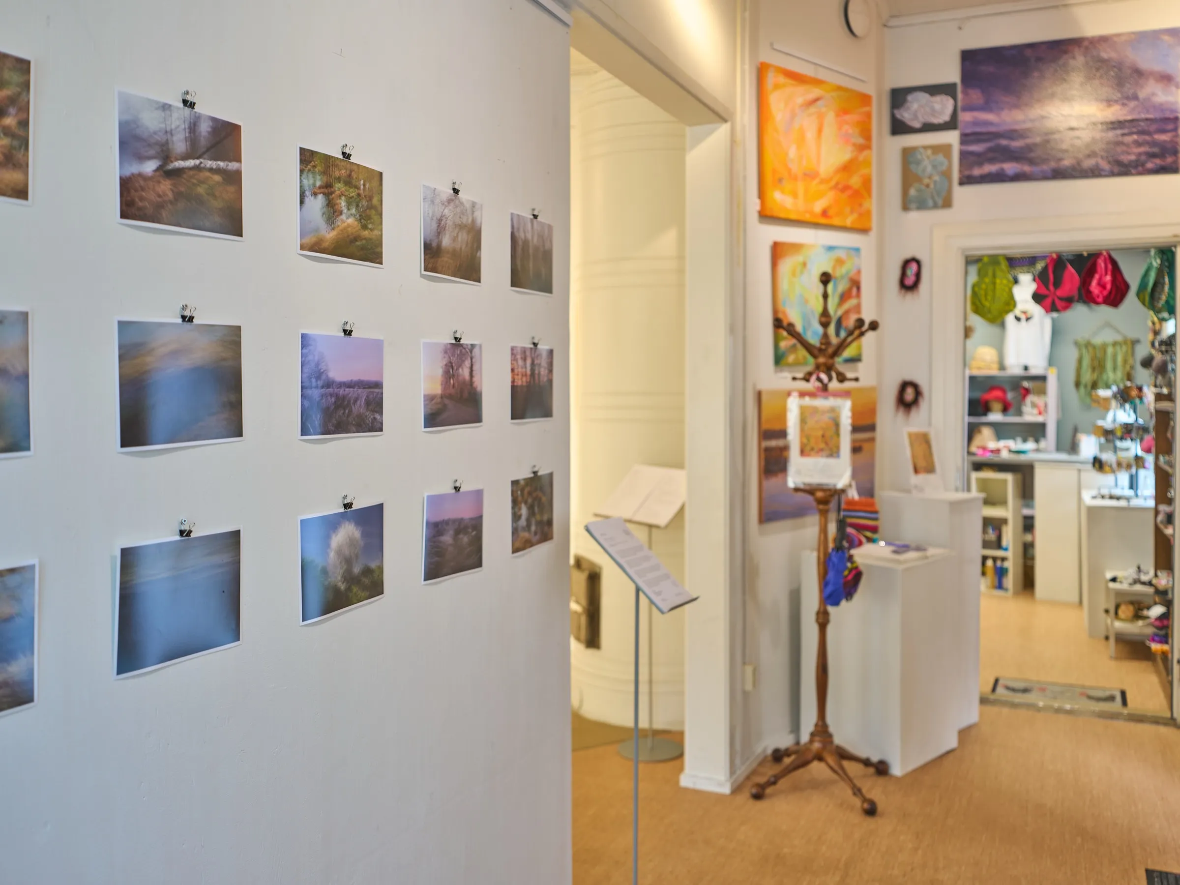 Photographs by Roman Thomas on a bright wall