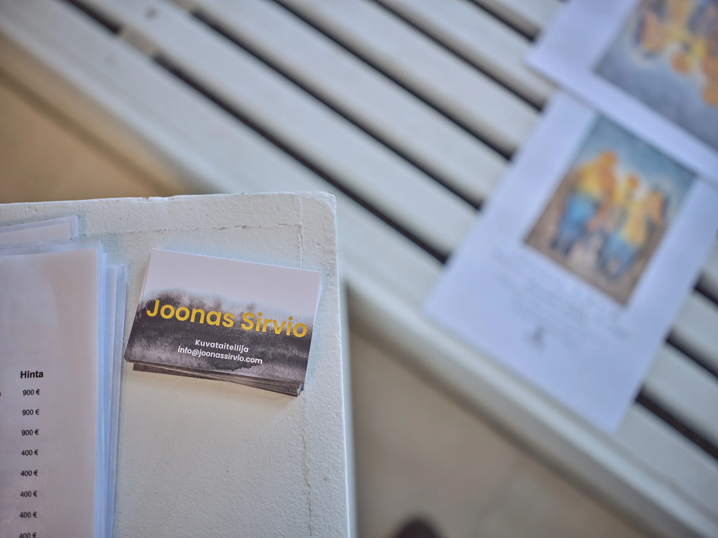 Joonas Sirviö's business cards on the gallery's guest book