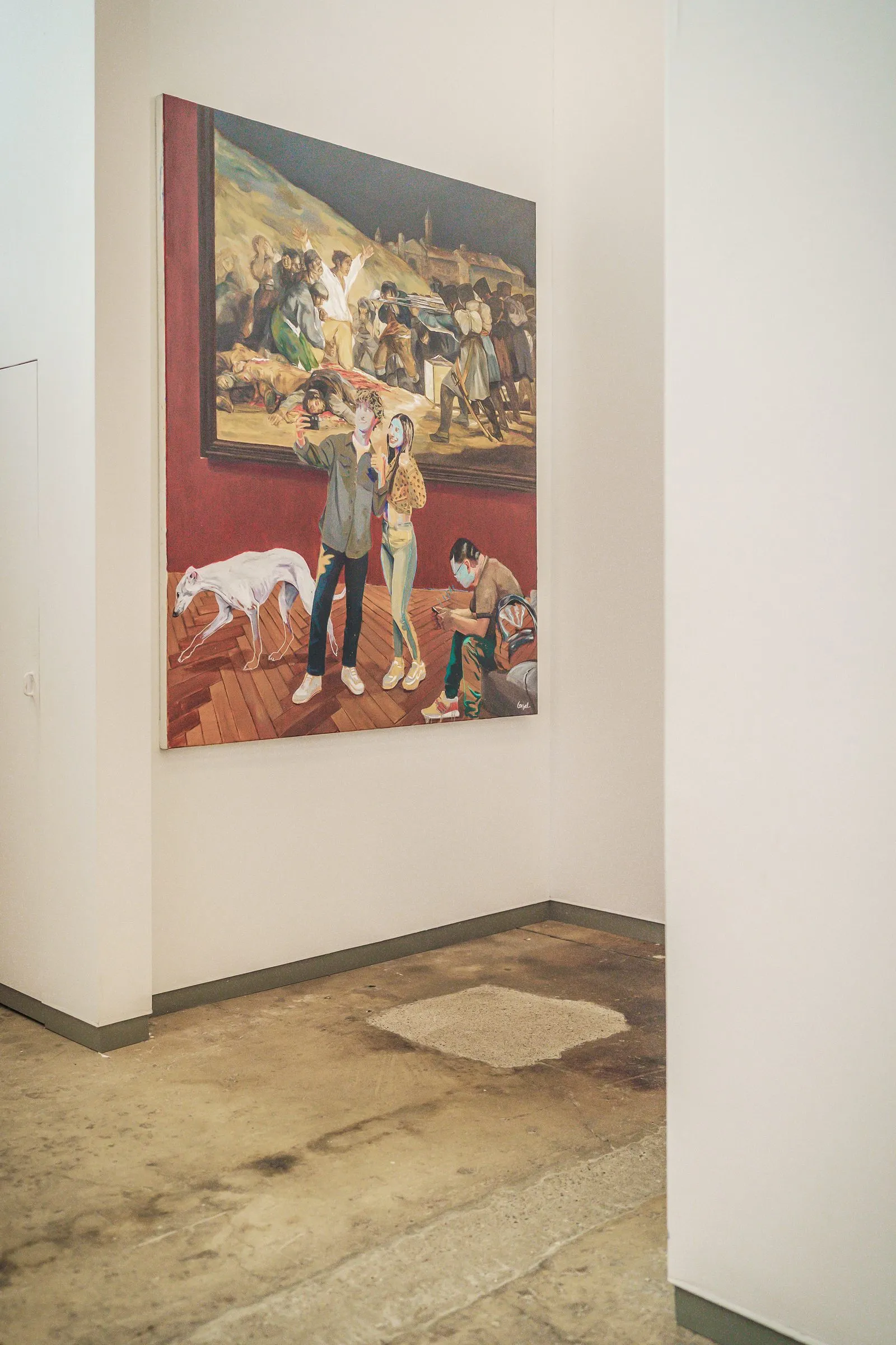 Portrait: a painting with several figures in warm colours on a white wall corner